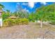 Large backyard with gazebo and tropical landscaping at 604 Pennsylvania Ave, Crystal Beach, FL 34681