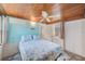Cozy bedroom with light blue walls and seashell bedding at 604 Pennsylvania Ave, Crystal Beach, FL 34681