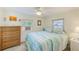 Bedroom with a double bed, dresser, and light blue bedding at 604 Pennsylvania Ave, Crystal Beach, FL 34681