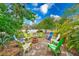 Enjoy evenings around the fire pit with colorful chairs at 604 Pennsylvania Ave, Crystal Beach, FL 34681