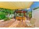Private backyard hot tub with gazebo and shade cover at 604 Pennsylvania Ave, Crystal Beach, FL 34681