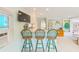 Charming kitchen with breakfast bar and green stools at 604 Pennsylvania Ave, Crystal Beach, FL 34681