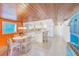 Bright kitchen with white cabinets, breakfast nook, and island at 604 Pennsylvania Ave, Crystal Beach, FL 34681