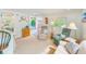 Bright living room featuring two armchairs and a sofa at 604 Pennsylvania Ave, Crystal Beach, FL 34681