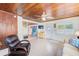 Spacious living area with wood ceiling and access to other rooms at 604 Pennsylvania Ave, Crystal Beach, FL 34681