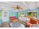 Relaxing screened porch with wicker furniture and view of patio at 604 Pennsylvania Ave, Crystal Beach, FL 34681