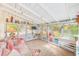 Bright sunroom features a comfy couch and lots of windows at 604 Pennsylvania Ave, Crystal Beach, FL 34681