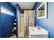 Functional bathroom with a shower, vanity, and storage shelves at 612 12Th S Ave, St Petersburg, FL 33701