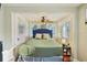 Serene bedroom with ample natural light, a ceiling fan, and a comfortable bed at 612 12Th S Ave, St Petersburg, FL 33701