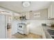Cozy kitchen featuring white cabinets, granite countertops, and stainless steel appliances at 612 12Th S Ave, St Petersburg, FL 33701
