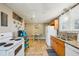 Well-lit kitchen featuring wood cabinets, tile flooring, and a seamless transition to the adjacent dining area at 612 12Th S Ave, St Petersburg, FL 33701