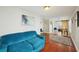 Comfortable living room featuring hardwood floors, bright walls, and a cozy blue couch at 612 12Th S Ave, St Petersburg, FL 33701
