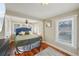Inviting bedroom featuring hardwood floors, large windows, and a comfortable bed at 612 12Th S Ave, St Petersburg, FL 33701