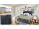Stylish bedroom featuring a mounted television, a fan and windows for natural light at 612 12Th S Ave, St Petersburg, FL 33701