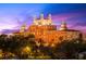 Evening view of a grand, historic-looking building with ornate details at 6265 Sun Blvd # 101, St Petersburg, FL 33715