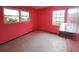 Bright bedroom with pink walls, two windows, and built-in shelving at 6692 17Th N Way, St Petersburg, FL 33702