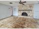 Living room with a stone fireplace and ceiling fan at 6692 17Th N Way, St Petersburg, FL 33702