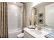 Clean bathroom with white vanity, shower, and bathtub at 710 Sky Shade Dr, Apollo Beach, FL 33572