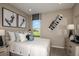 Charming bedroom with a comfortable bed and window seat at 710 Sky Shade Dr, Apollo Beach, FL 33572