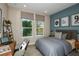 Cozy bedroom with a queen bed and built-in workspace at 710 Sky Shade Dr, Apollo Beach, FL 33572