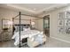Bright bedroom featuring a comfortable bed and en-suite bathroom access at 710 Sky Shade Dr, Apollo Beach, FL 33572
