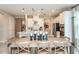Open concept kitchen and dining area with farmhouse table at 710 Sky Shade Dr, Apollo Beach, FL 33572