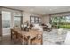 Casual dining area with large table and access to backyard at 710 Sky Shade Dr, Apollo Beach, FL 33572