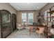Bright home office features built-in shelving and large windows at 710 Sky Shade Dr, Apollo Beach, FL 33572