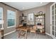 Home office with wood desk and chairs, and decorative shelving at 710 Sky Shade Dr, Apollo Beach, FL 33572