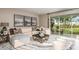 Spacious living room with sectional sofa and sliding doors at 710 Sky Shade Dr, Apollo Beach, FL 33572