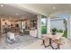 Open-concept patio with sliding doors leading to the backyard at 710 Sky Shade Dr, Apollo Beach, FL 33572