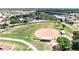 Community baseball field with seating and surrounding landscape at 711 E Brockton Pl, Sun City Center, FL 33573