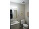 Clean bathroom with toilet, sink, and shower/tub combo at 711 E Brockton Pl, Sun City Center, FL 33573