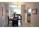 Bright dining area with a table, four chairs, and a view into the kitchen at 711 E Brockton Pl, Sun City Center, FL 33573