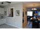 Open kitchen with a breakfast bar and a view to the dining room at 711 E Brockton Pl, Sun City Center, FL 33573