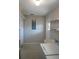 Laundry room with washer, dryer, and extra shelving at 711 E Brockton Pl, Sun City Center, FL 33573
