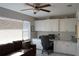 Home office with built-in cabinetry, a desk, and comfortable seating at 711 E Brockton Pl, Sun City Center, FL 33573