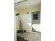 Exterior storage room with tiled floor and a green door at 711 E Brockton Pl, Sun City Center, FL 33573