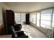 Bright sunroom featuring ample windows, tile floors, and comfortable seating at 711 E Brockton Pl, Sun City Center, FL 33573