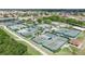 Community tennis courts with seating and surrounding landscape at 711 E Brockton Pl, Sun City Center, FL 33573