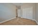 Well-lit bedroom with double door closet and carpet flooring at 8044 Lago Mist Way, Wesley Chapel, FL 33545