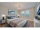 Elegant bedroom with hardwood floors and stylish decor at 8044 Lago Mist Way, Wesley Chapel, FL 33545