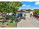 House with landscaped yard and driveway, aerial perspective at 9445 Barnstead Ln, Port Richey, FL 34668