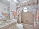 Clean bathroom with a tub shower combo and updated vanity at 9445 Barnstead Ln, Port Richey, FL 34668