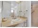 Bathroom with a vanity and walk-in shower at 9445 Barnstead Ln, Port Richey, FL 34668