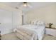 Well-lit bedroom with a comfortable bed and nightstand at 9445 Barnstead Ln, Port Richey, FL 34668