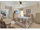 Bright bedroom with floral bedding and ample closet space at 9445 Barnstead Ln, Port Richey, FL 34668