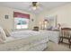 Serene bedroom with a double bed and plenty of light at 9445 Barnstead Ln, Port Richey, FL 34668