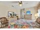 Charming bedroom with floral bedding and dresser at 9445 Barnstead Ln, Port Richey, FL 34668