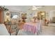 Open concept dining room with view of living room and kitchen at 9445 Barnstead Ln, Port Richey, FL 34668